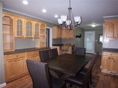 Kitchen has lots of cabinets for storage.