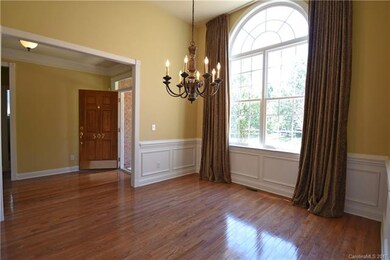 formal dining room.  note Palladium window.  foyer