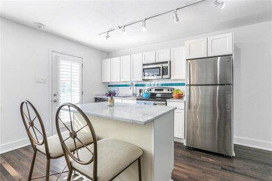 Kitchen island expands counter space & offered a f