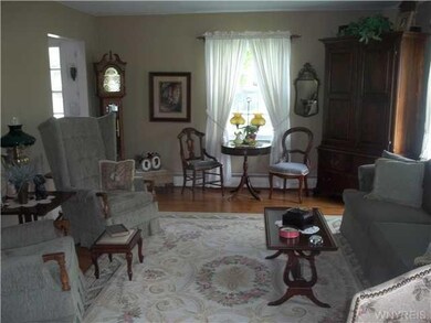 Living Room. Hardwood floors begin at the front do