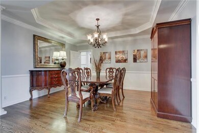 The Formal Dining Room offers a tray ceiling, elegant trim and a beautiful light fixture