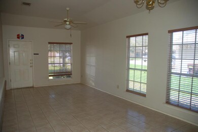 Empty room featuring plenty of natural light, cei