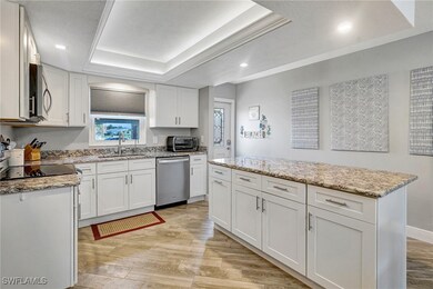 Kitchen featuring stainless steel appliances, a ra