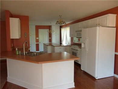 Kitchen opens up into living room and dining