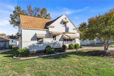 View of front of home featuring roof with shingles