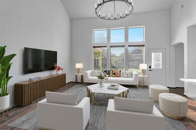 Gather the family and guests together in your lovely living room! Featuring high ceilings, custom light fixture, warm paint, gorgeous floors, and large windows that provide plenty of natural lighting throughout the day.
