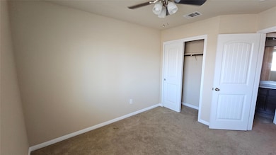 Unfurnished bedroom with carpet, a closet, and ce