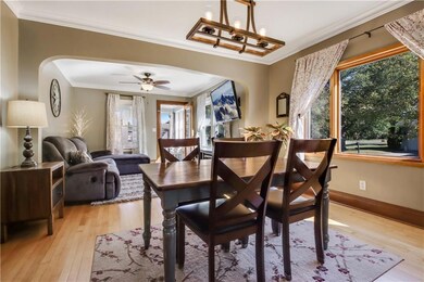 Dining area flows into living space and front porc