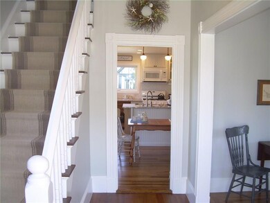 Front entry hall leading to the...