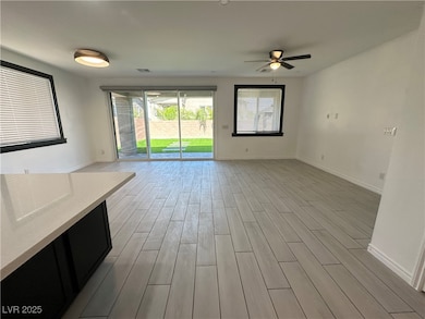 Unfurnished living room featuring light wood-style