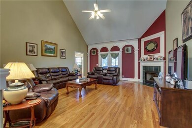 Soaring ceilings in living room with extensive trimwork