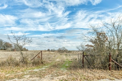View of yard with a rural view