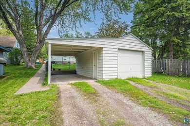 Garage featuring driveway