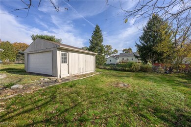 View of yard featuring a garage