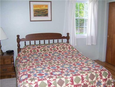 Master Bedroom. Lovely hardwood floors and new replacement windows.