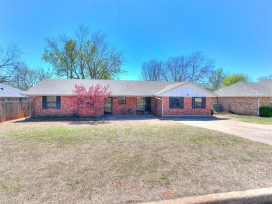 Ranch-style home featuring a front lawn