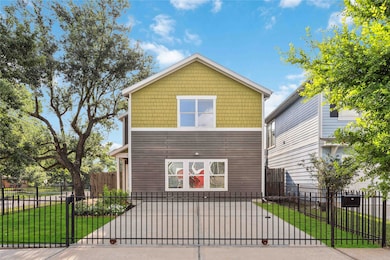The gated driveway provides protected parking for