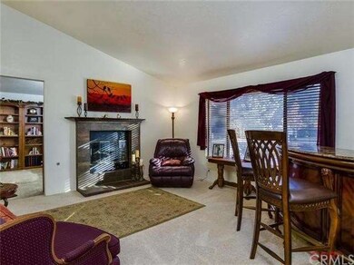 Formal living room being used as a sitting area wi