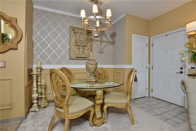 Dining area has a beautiful accent wall and custom