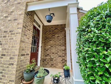 Entrance to property featuring brick.