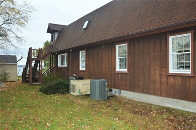 Side of home and 2 newer Trane Units and Generac Generator.