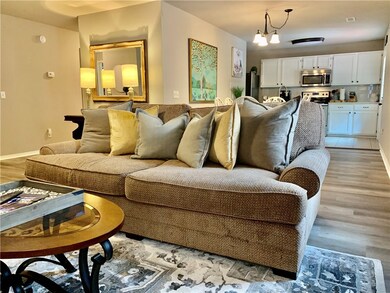 Comfy and cozy living space is open to dining and kitchen.