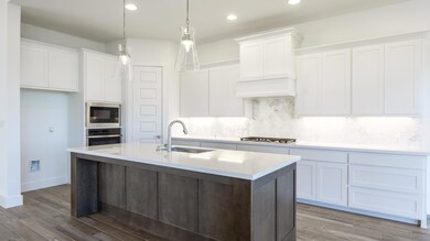Kitchen featuring a sink, stainless steel applian