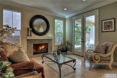 Living room with French doors and cozy fireplace