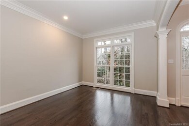 Living room or study; French doors separate this r