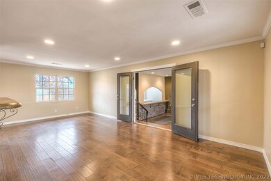 Open living space includes recessed lighting, natu