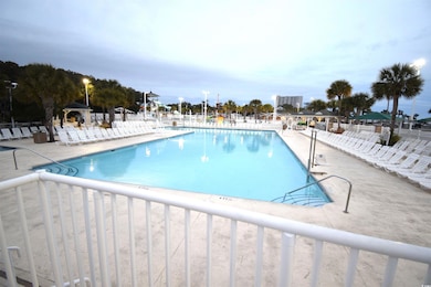 View of pool featuring a gazebo and a patio