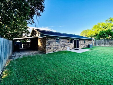 Rear view of house featuring central air condition
