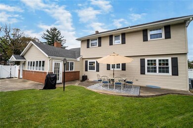 Fenced in spacious backyard with shed