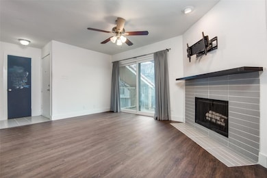 Unfurnished living room featuring baseboards, ceil