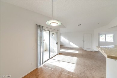 View from Dining Area, showing doors to Balcony, L