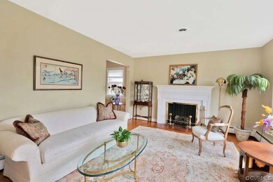 Formal Living Room with fireplace, wood floors.