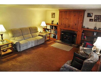 Living Room. OPEN LIVING ROOM FEATURES A LOG BURNI
