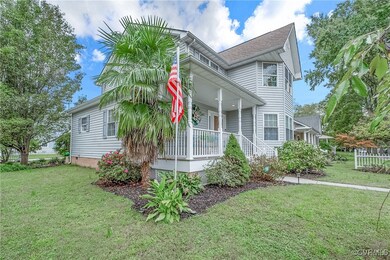 View of front of home featuring a front yard and c