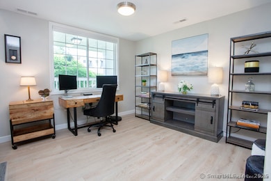 One end of living room turned into cool office space