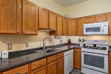 Spicket Commons unit 108, Methuen, MA 01844 - photo 5