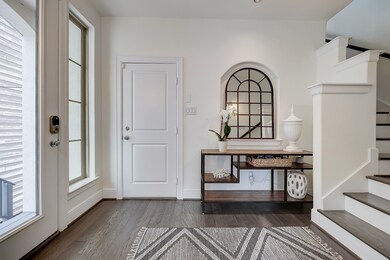 View of large entry and door to two story garage