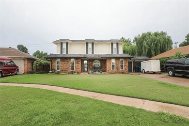 Traditional-style house featuring brick siding, a front lawn, and covered porch