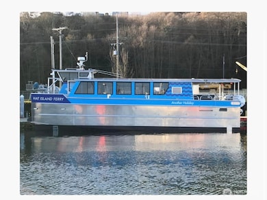 'Another Holiday' is Hat Islands own 48 passenger foot ferry, it runs between Hat & Everett on a regular route. Reservations are made by the property owner for their guests.