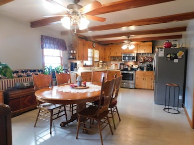 Your kitchen and dining room area boost a beamed ceiling and plenty of room for entertaining family and friends.  A stainless steel stove and microwave makes cooking a pleasure.  The large stainless steel refrigerator is negotiable.