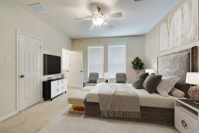 Come and unwind after a long day in this magnificent master suite! This spacious room features plush carpet, custom paint, ceiling fan with lighting and large windows with privacy blinds.
