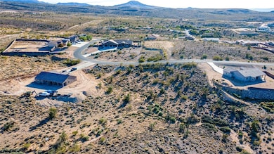 Bird's eye view of a mountain backdrop and a desert landscape