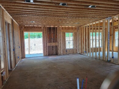 Very large kitchen with oversized island opens to the living room.  Kitchen will have double ovens, gas cooktop - stainless finishes.  You can pick the counters!