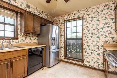 Kitchen featuring SS Appliances and lot of natural light