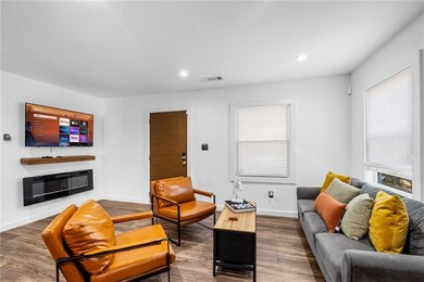 Living area featuring visible vents, a wealth of n