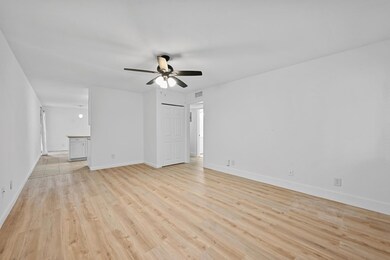 Unfurnished living room with light wood-type floo